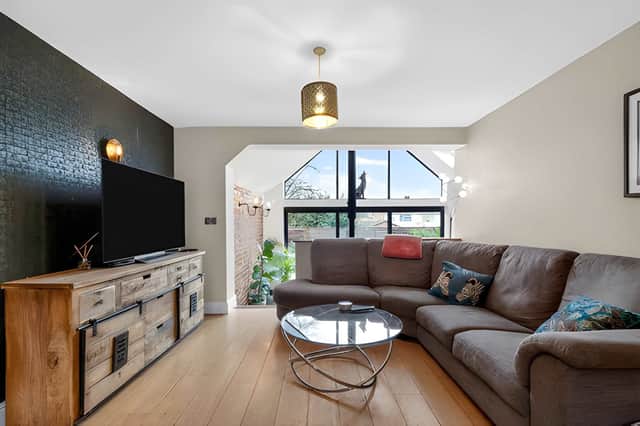 A vaulted ceiling helps create a bright and welcoming living space with plenty of room to relax and gather.
