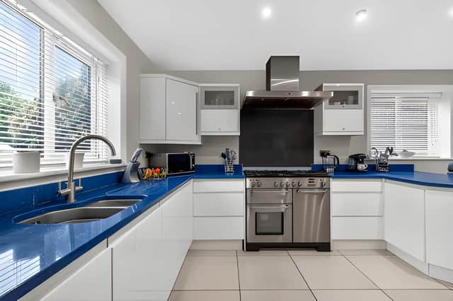 The spacious kitchen forms the heart of the home, designed to support both everyday family life and entertaining.
