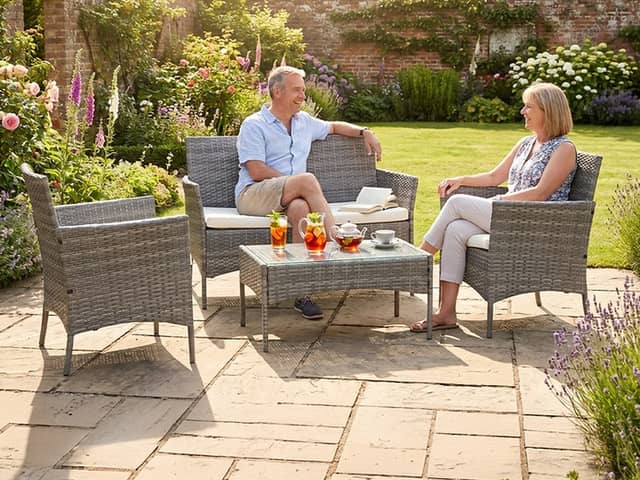 The £67 garden furniture set includes a two-seater sofa, two armchairs and a tempered glass coffee table