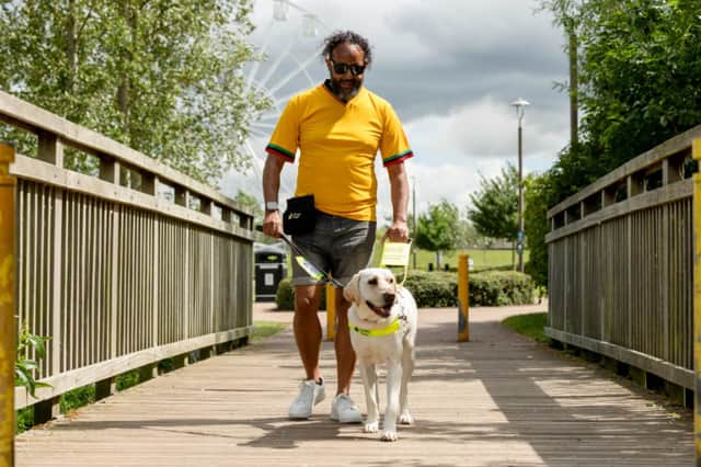 Sha from Milton Keynes with guide dog Moby.