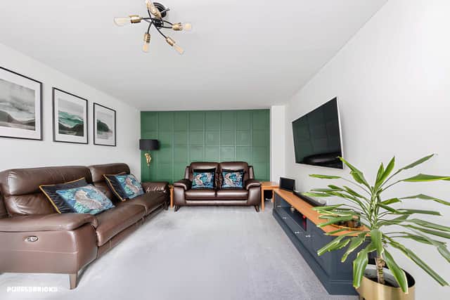 A spacious sitting room provides a separate reception space within this thoughtfully planned four-bedroom home