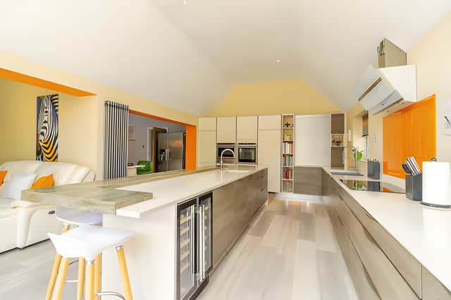 The large open kitchen, dining and family room forms the heart of the extended home's ground-floor accommodation