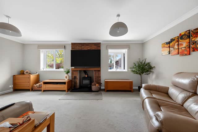 The separate lounge has dual-aspect windows and a log burner.