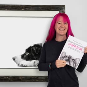 Becky with her book and one of the drawings featured as a tutorial.
