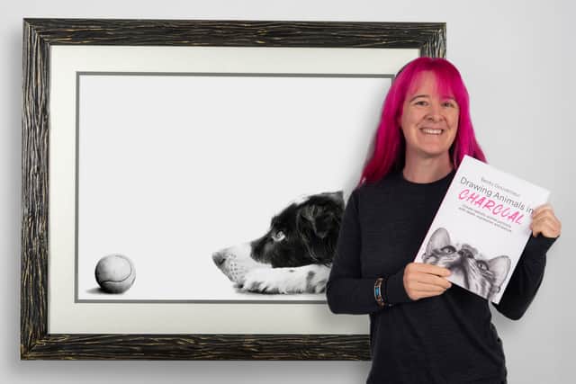 Becky with her book and one of the drawings featured as a tutorial.