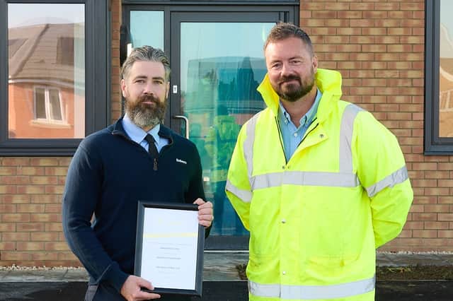 James Ratcliffe (left), Site Manager at Bellway’s Greenleys Gardens development in Milton Keynes, was presented with award by Craig Ewles from LABC Warranty.