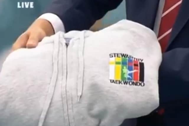 The grey hooded jumper Leah was wearing when she disappeared is displayed on BBC Crimewatch