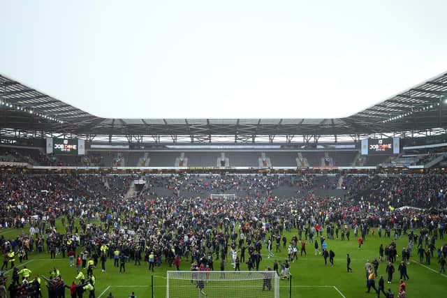 Fans invade the pitch after the Sky Bet League Two match between Milton Keynes Dons and Mansfield Town at Stadium mk on May 04, 2019 in Milton Keynes, United Kingdom. (Photo by Bryn Lennon/Getty Images)