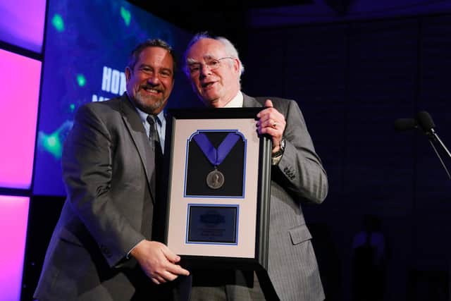 Paul Kellar (right) receives his award from SMPTE president Matthew Goldman