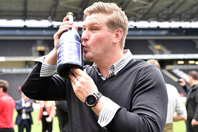 Robinson celebrating promotion with MK Dons in 2015.
