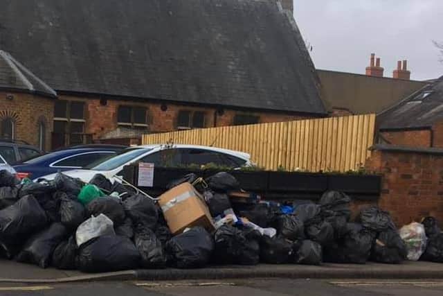 The rubbish moutain is blocking the pavement