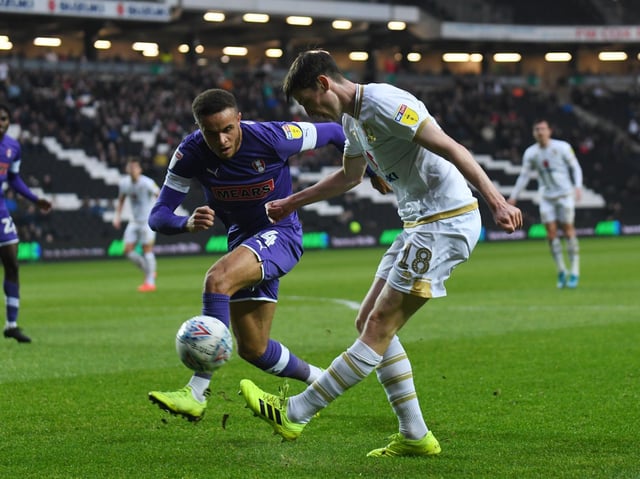 Carlton Morris closes down Conor McGrandles when Rotherham played at Stadium MK last month.