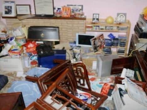 Police photos show how the burglars trashed her home