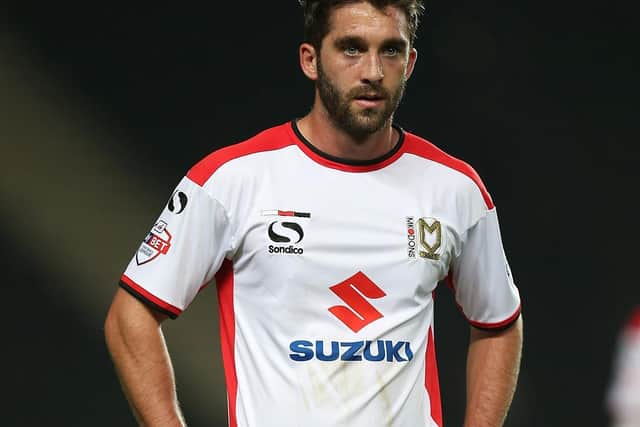 Will Grigg played for MK Dons during their promotion-winning campaign in 2014/15