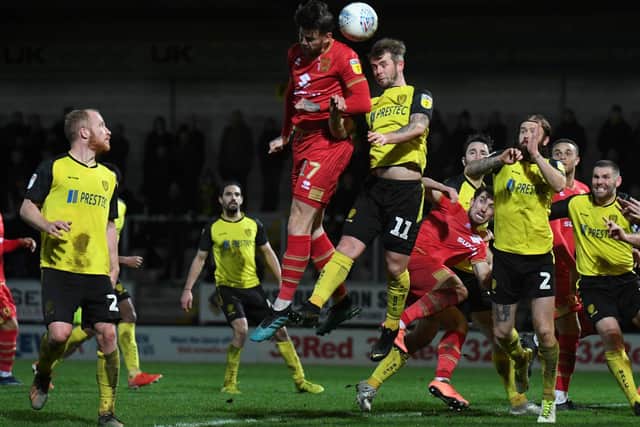 Gladwin battles in the air against Burton Albion.