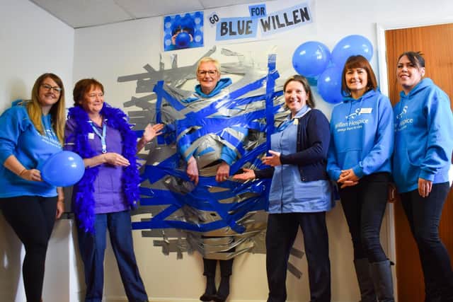 Willen Hospice chief executive Peta demonstrates the wall taping technique