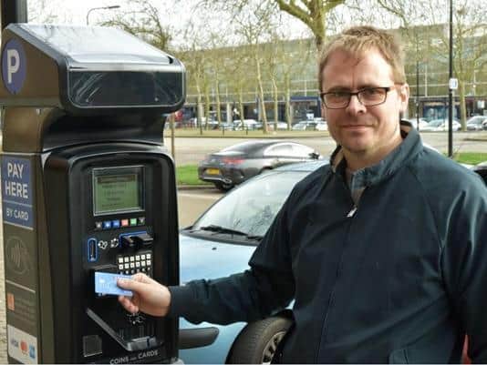 Councillor Martin Gowans demonstrates one of the new machines