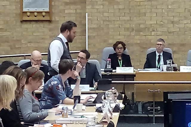 Council leader Pete Marland, standing