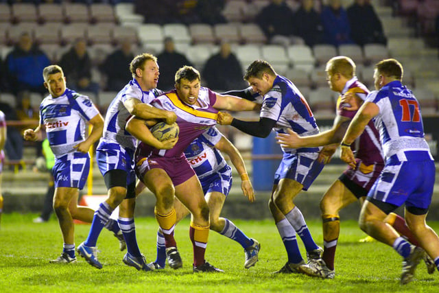 Batley's Keegan Hirst is stopped by the Halifax defence in 2013.