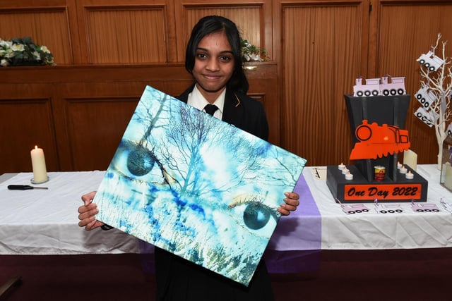 Agnes Robin, 13, a pupil at St John Fisher RC High School, with her work chosen as part of a national gallery for Holocaust Memorial Day 2022, pictured at the ceremony at Wigan Town Hall.