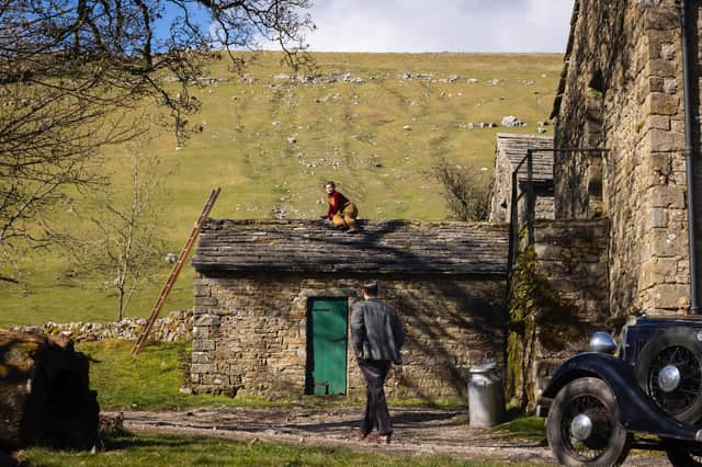 Helen mending the roof in series 2, episode 3. The Aldersons' farm is at Yockenthwaite in the Langstrothdale valley in the Yorkshire Dales National Park.