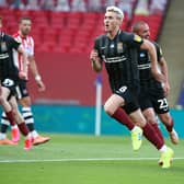 Former Dons midfielder Ryan Watson opened the scoring at Wembley for Northampton