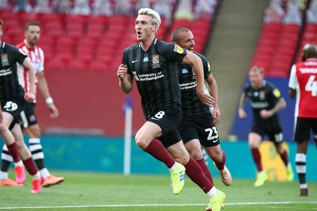 Former Dons midfielder Ryan Watson opened the scoring at Wembley for Northampton