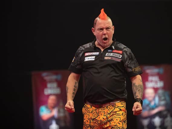 Peter Wright overcame a first-round scare. Pic: Lawrence Lustig/PDC
