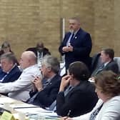 Cllr Terry Baines (standing) at a pre-lockdown council meeting