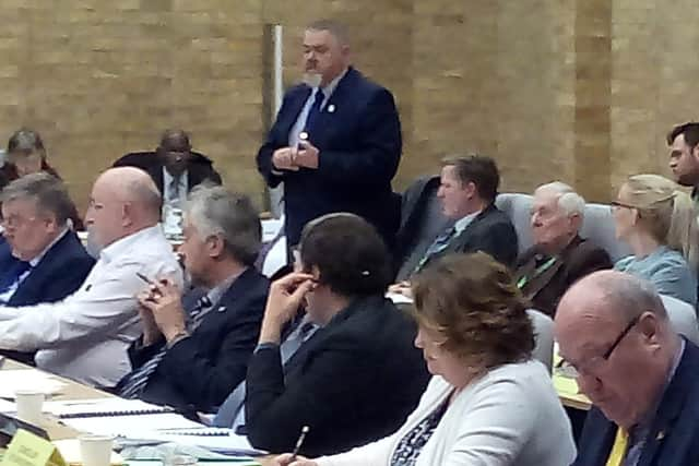 Cllr Terry Baines (standing) at a pre-lockdown council meeting