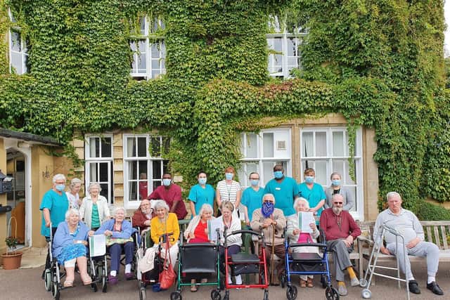 Tickford Abbey staff and residents celebrate winning the award