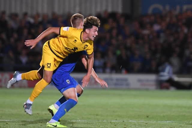 Poole in action against AFC Wimbledon