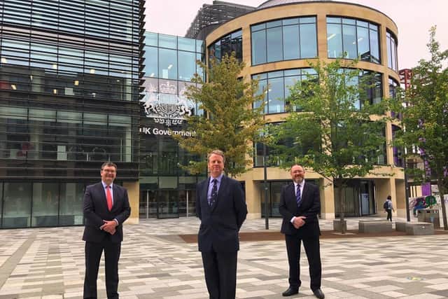 Iain Stewart (left) with Alister Jack and David Duguid outside the new offices