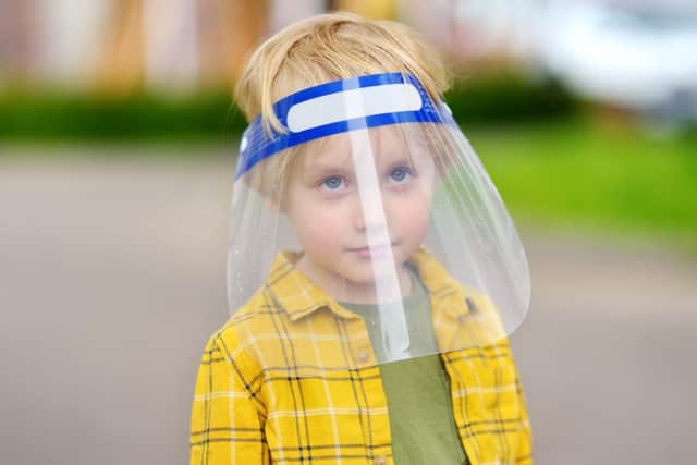 The academy's pupils must wear face shields at their desks, or continue to wear their masks if they prefer.