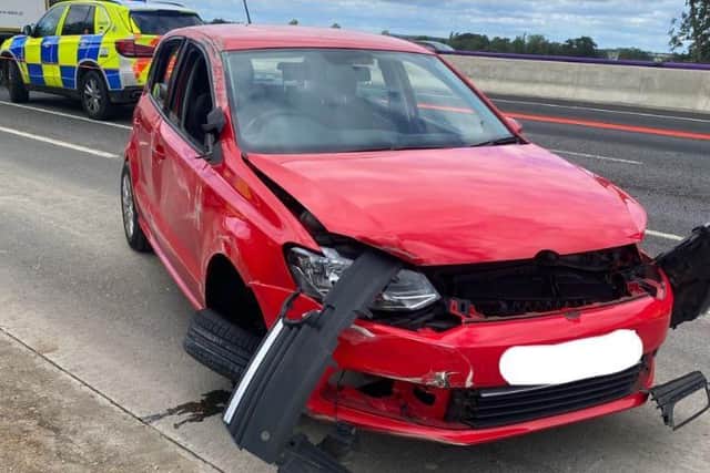 This VW finished up on its side after Wednesday's smash on the M1. Photo: Northamptonshire Police