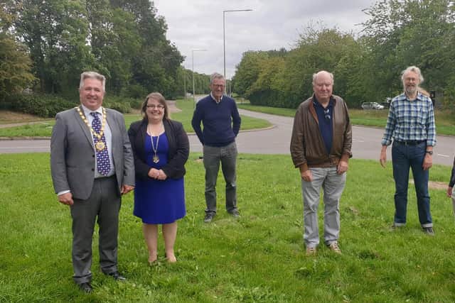Mayor Andrew Geary meets former MKDC employees at the first section of grid road, started 50 years ago today.