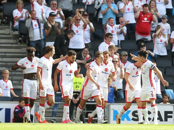 MK Dons celebrate Callum Brittain's first goal for the club