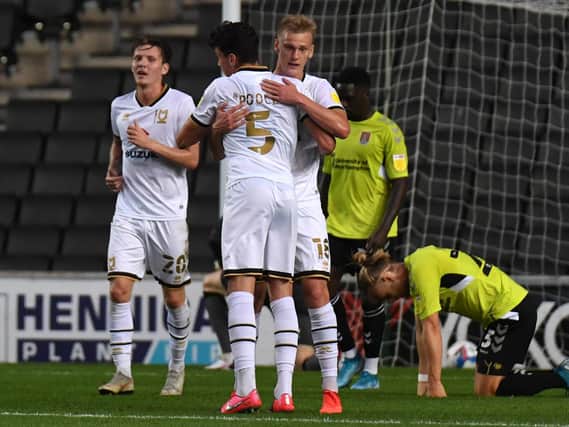Regan Poole celebrates his first goal for MK Dons