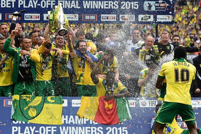 Cameron Jerome celebrates promotion with Norwich City, captained by Russell Martin