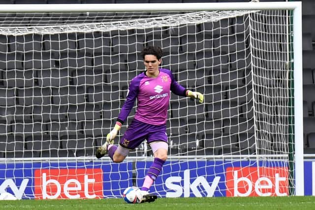 Keeper Lee Nicholls with the ball at his feet