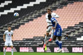 Carlton Morris goes up for a header