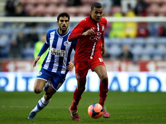 Dele Alli in action against Wigan in 2014
