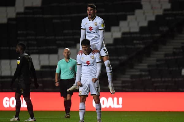 Regan Poole celebrates with goal-scorer Ste Walker