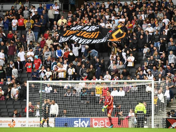MK Dons supporters against AFC Wimbledon last season