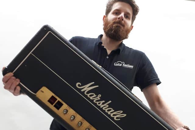 Auctioneer Luke Hobbs with one of the Marshall amps