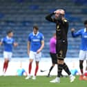 Richard Keogh shows his frustration after Portsmouth score