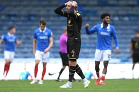 Richard Keogh shows his frustration after Portsmouth score