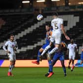 Regan Poole goes up for a header
