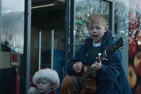 The brothers sing an Oasis cover outside their local Co-op