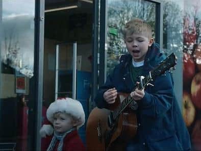 The brothers sing an Oasis cover outside their local Co-op